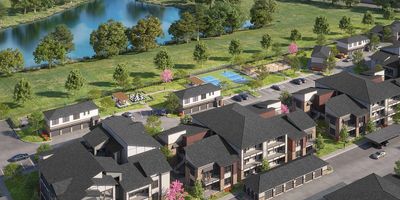 Aerial view of a residential complex near a river.