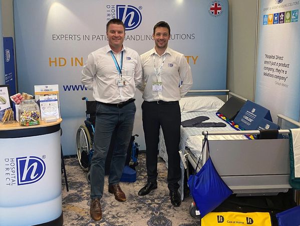 Hospital Direct reps on a dressed stand showcasing the products.