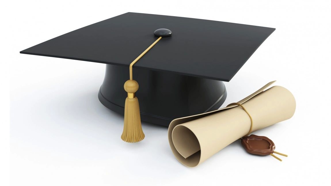 A graduation cap and a rolled diploma with a wax seal.