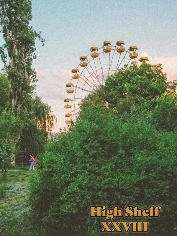 Cover of High Shelf XXVIII: a large green bush in the foreground. Behind it, a ferris wheel rises.