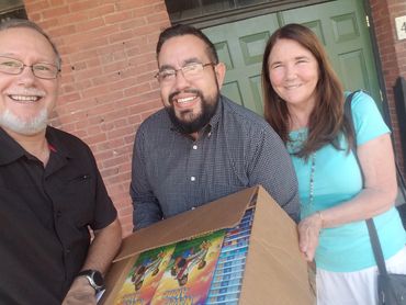 Pedro picks up donation of teaching materials for the students.