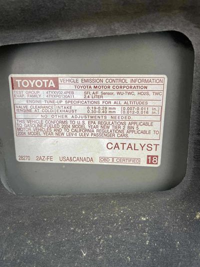 Toyota vehicle emission control information label with engine specifications.