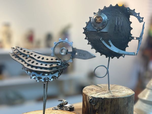 Recycled, metal, bird and fish sculptures by Romeo Industries crafted from sprockets tools and auto
