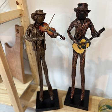 Handcrafted Paverpol fabric sculptures of two musicians, playing violin and guitar by Lise McAlpine