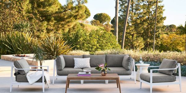 White aluminum patio set with gray cushions & tapered coffee table