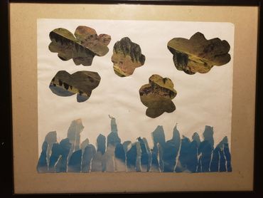 collage of grass and sky. the grass is in the clouds, and the sky is on the bottom.