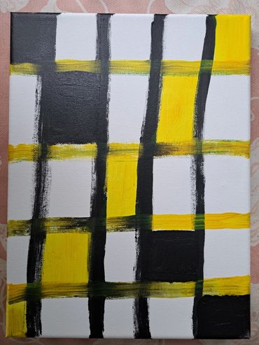 an abstract painting in yellow and black squares.