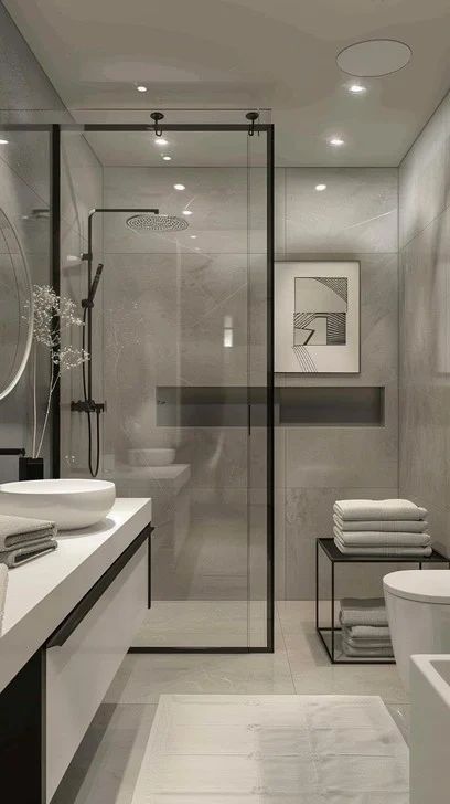Modern luxury bathroom remodel with frameless glass shower and custom modern finishes.