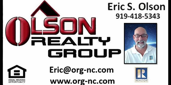 Business card for Eric S. Olson of Olson Realty Group with contact info.