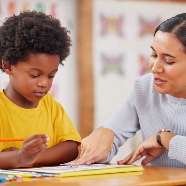 Consultant observing caregiver and child interaction to support emotional regulation strategies.