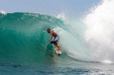 Surfer getting barreled