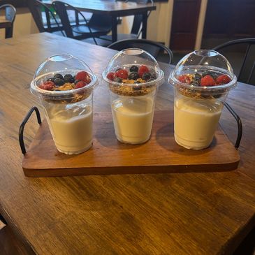 Vanilla yogurt with granola and fresh blueberries and raspberries