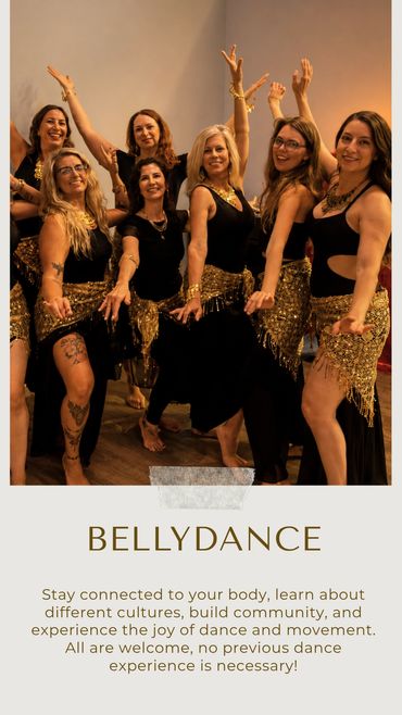 Group of women belly dancing together with golden scarves.