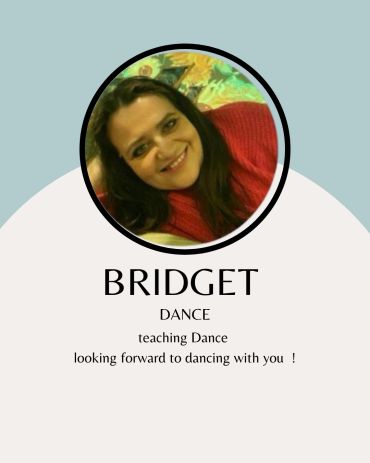 Portrait of Bridget, a dance teacher, smiling warmly.