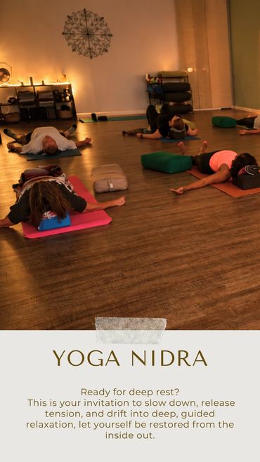 Group practicing Yoga Nidra for deep relaxation in a calm studio.