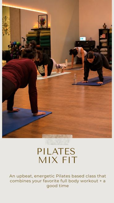 Group Pilates class doing plank exercises indoors.