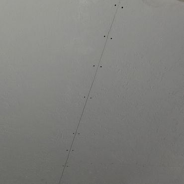 Ceiling with a long, thin crack and multiple screw holes near an air vent.