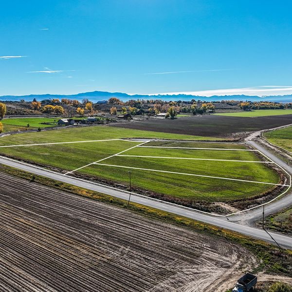 Vacant land with the lot lines defined and the fall colors and mountains in the background.
