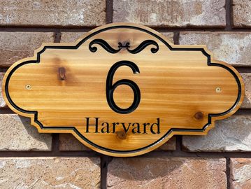 Wooden house number plaque with the number 6 and the word Harvard.