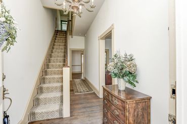 Original staircase in a grand foyer of a historic home in downtown Annapolis