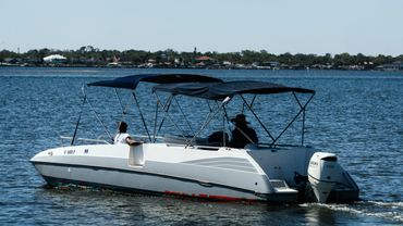 2 passengers on a deck boat