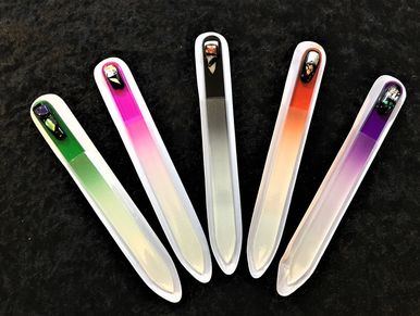 Glass nail files decorated with fused glass abstract designs.