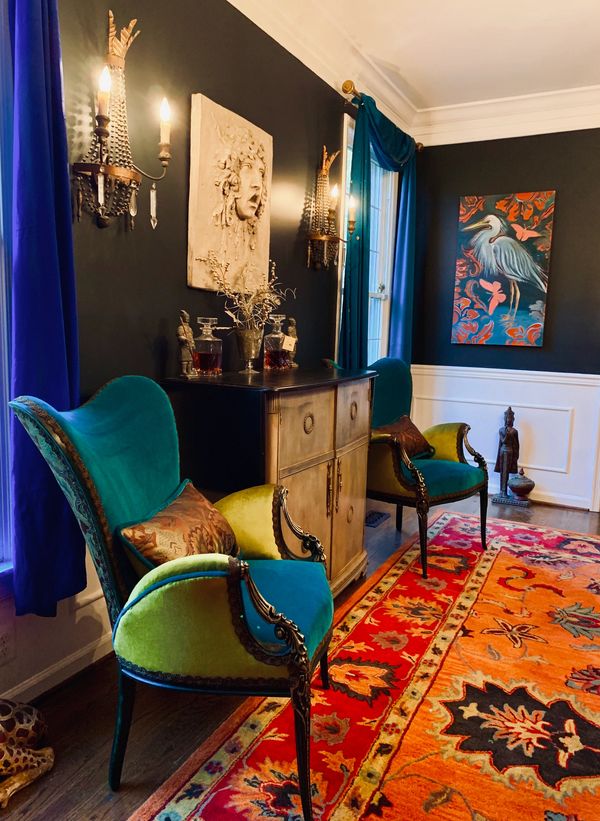 two teal and chartreuse color chairs in a luxury  living room