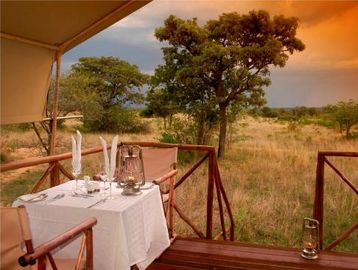 Outdoor dining setup overlooking a scenic natural landscape.