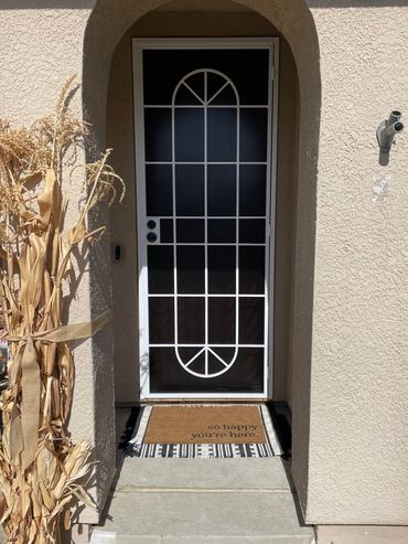 Modern and classic steel security door with white frame and locks.