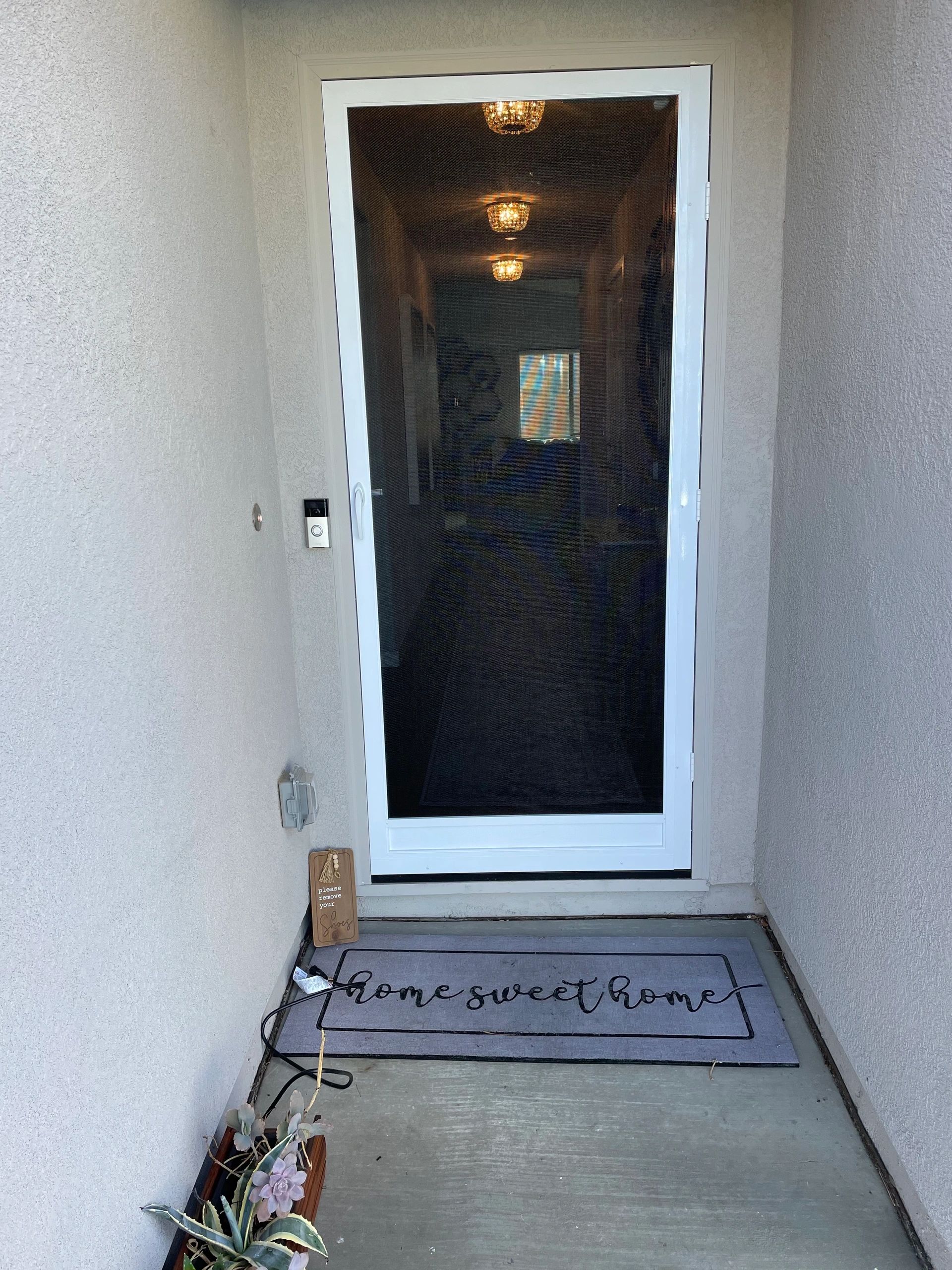 Custom swinging creen door added to the front exterior of a home.