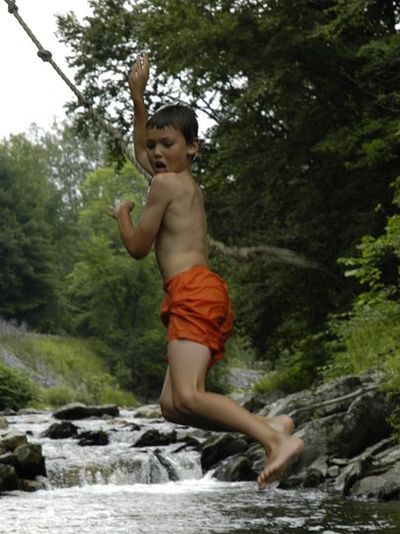 Matias Rosado swinging from rope into river. Suicide Prevention. Mental Health Awareness.