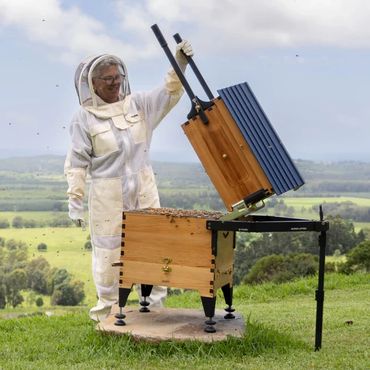Flow high tech simple direct to jar harvest bee hives and beekeeper