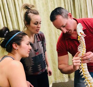 Explanation of hand placement for a thoracic adjustment.