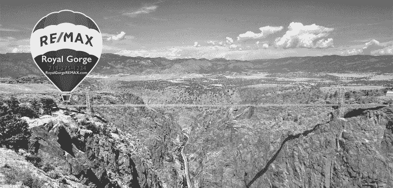 Picture of the RE/MAX balloon floating over the Royal Gorge in Canon City, Colorado.
