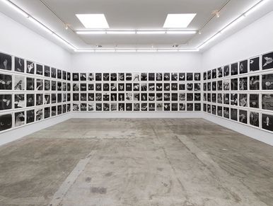 a room with portraits of hands of different artists 