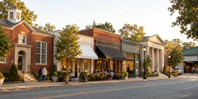 Charming small town street with shops and people.