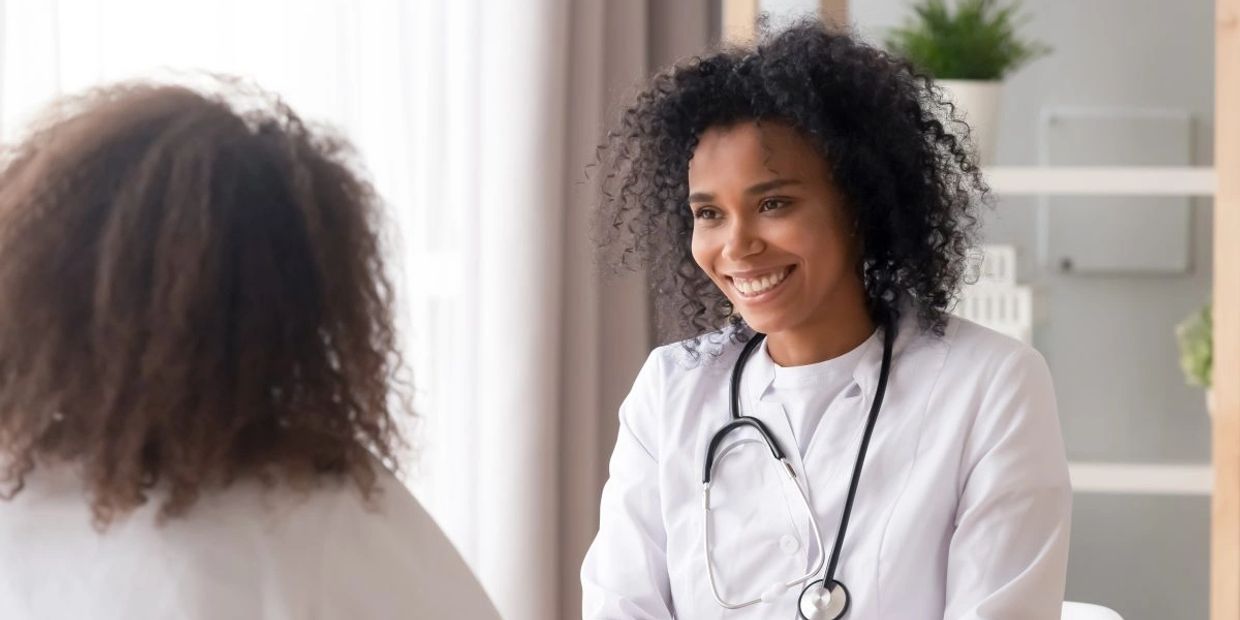A doctor talking to a woman