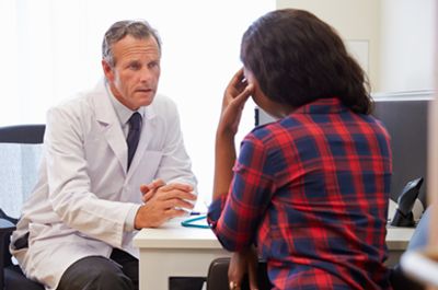 A patient talking to a doctor