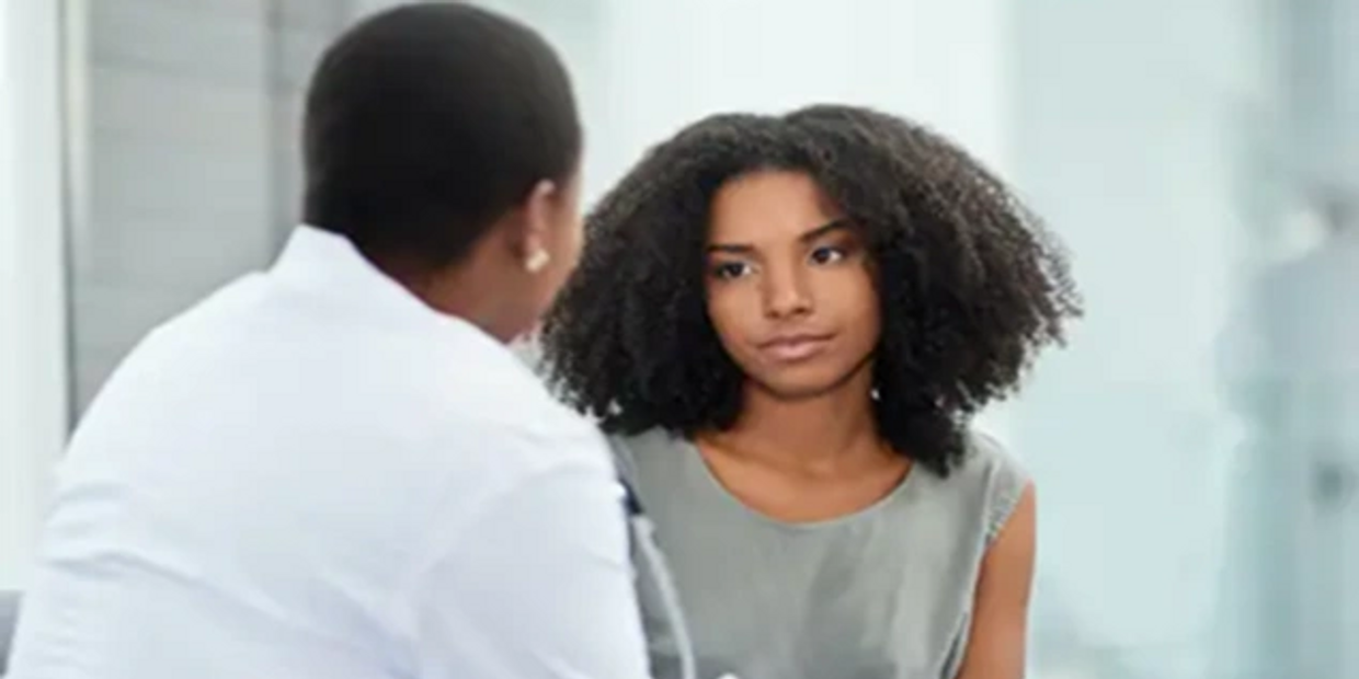 A woman talking to a doctor