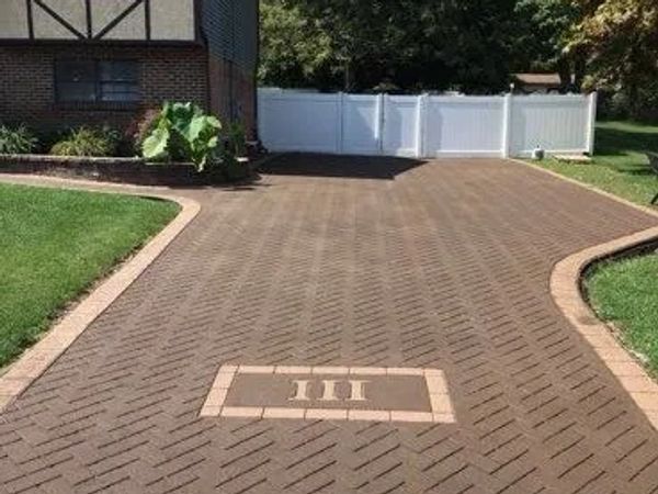 Driveway with Roman numeral III embedded in the pavement.