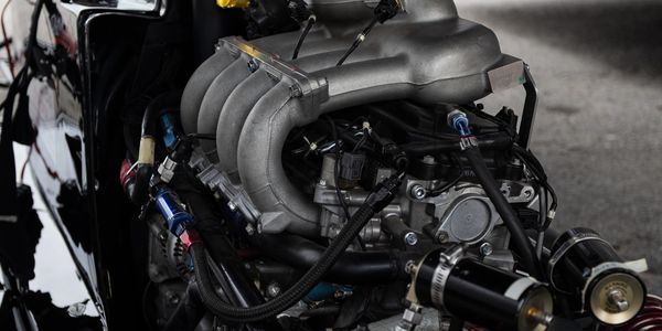 Close-up of a high-performance engine with intricate tubing and components.