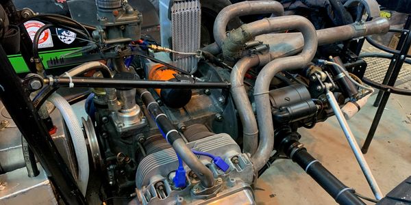 Close-up of a complex engine with pipes and mechanical parts.