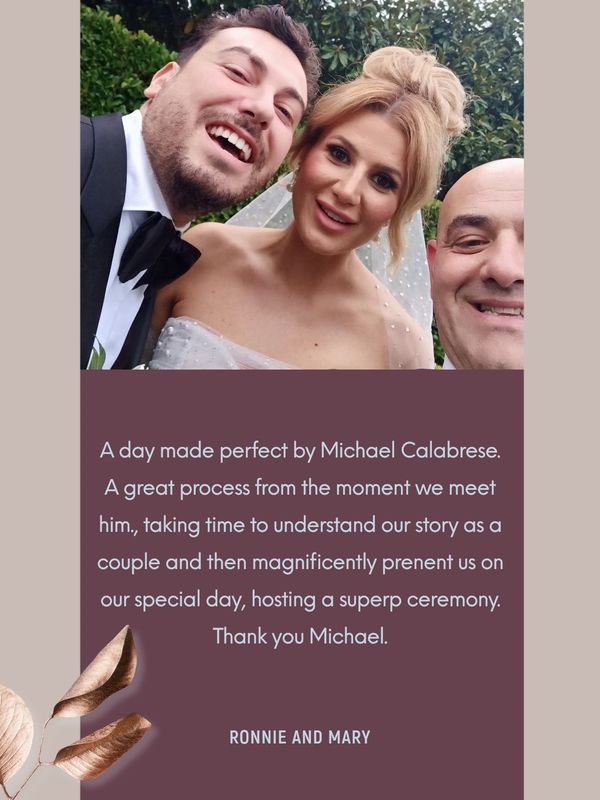 Happy couple with officiant on wedding day.