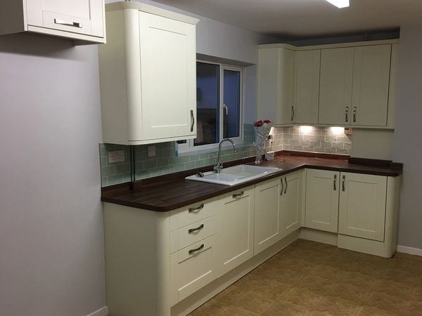 Kitchen units, tiling and sink