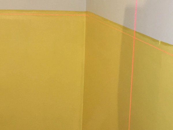 Use of lasers to ensure accuracy, two tone paint colours in a bedroom.