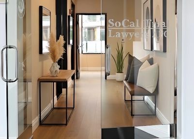 Modern office entrance with glass doors and stylish interior decor.