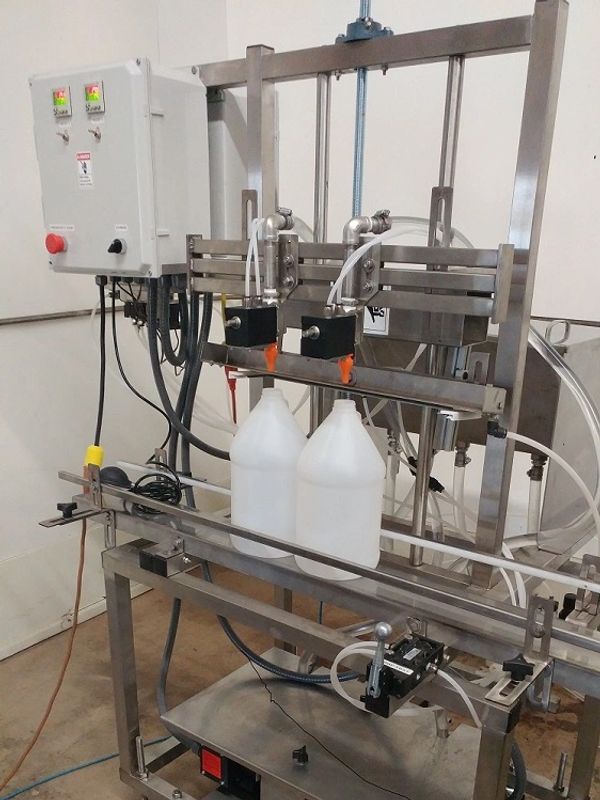 Pump filling machine capable of filling a variety of liquids.  Easy to clean and change over.