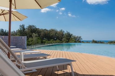 relax at the luxury hotel rooftop pool with stunning views of Bangtao Beach