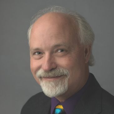 A man with gray hair and beard