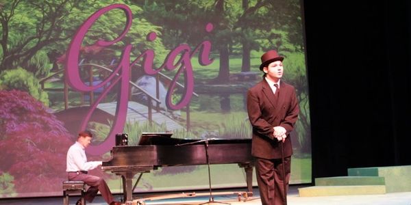 Ryan performing on stage in college